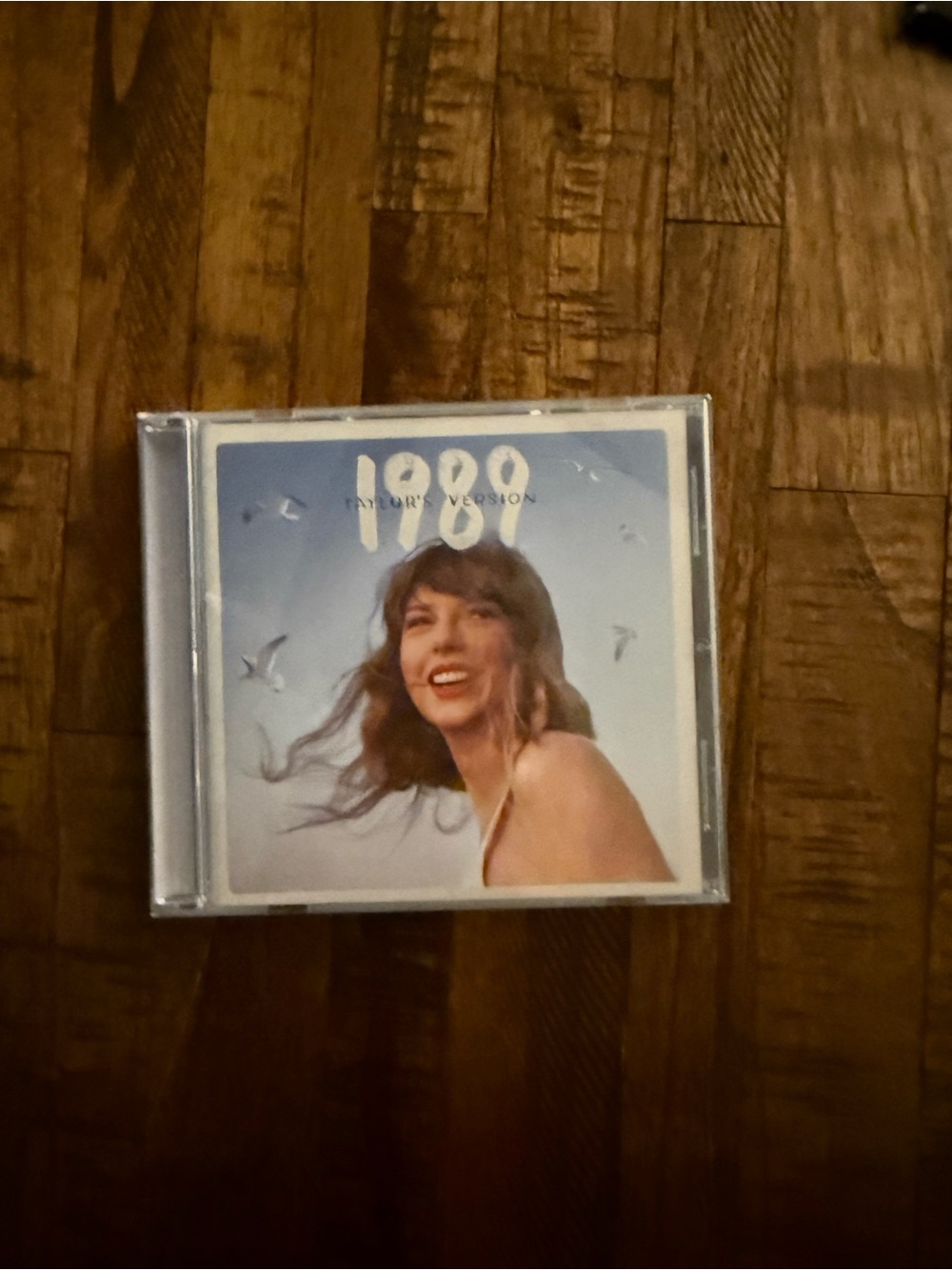 Taylor Swift CD with Blue and White Cover Art